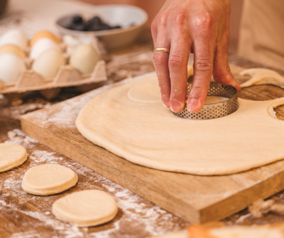 cut with dough with cutter into mini pizzas