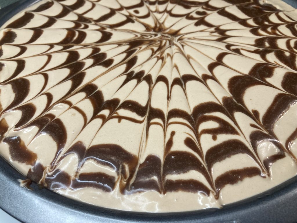 Three milk cake with chocolate on top.